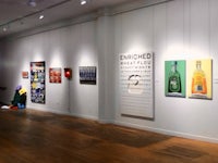 an art gallery with paintings on the walls