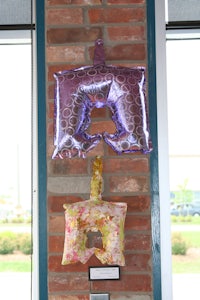 a group of balloons hanging on a wall