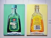 two paintings of bottles with labels on them